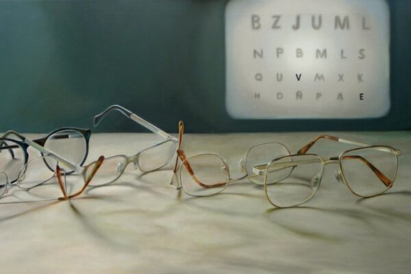 Photo which has eyeglasses on the table.