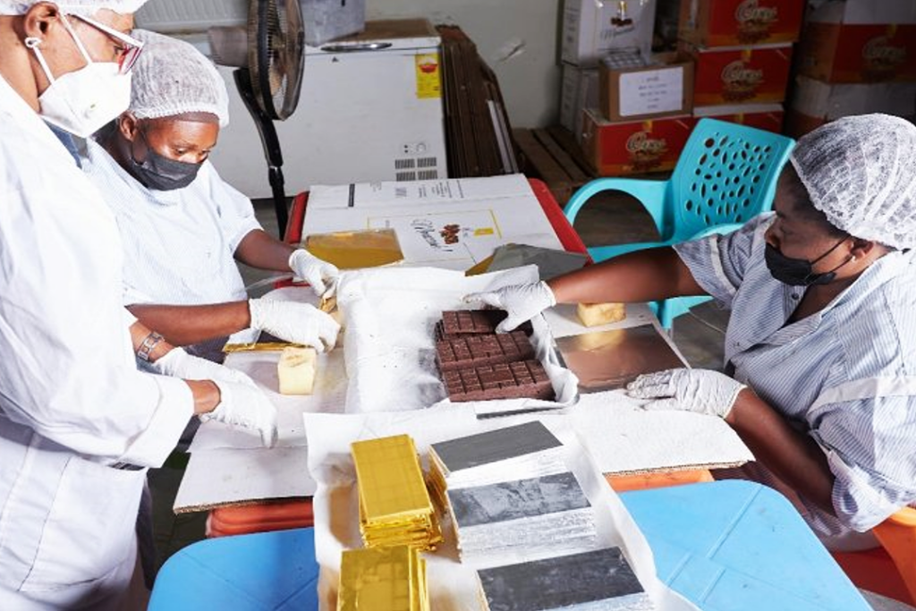 Photo about women making chocolate.